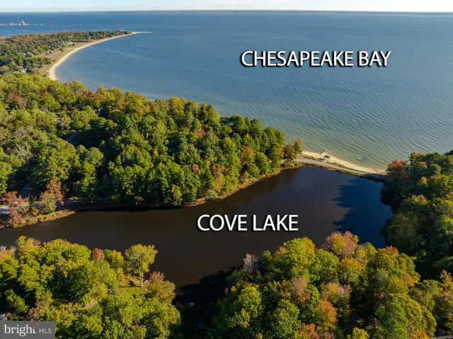 a kitchen with cabinets and chairs in it