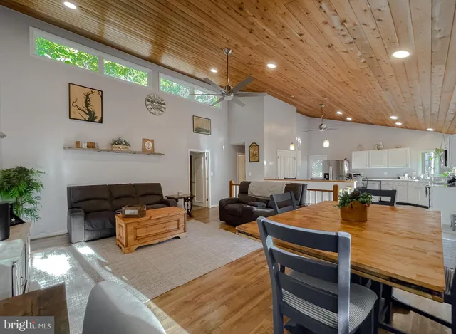 a kitchen with stainless steel appliances granite countertop a stove top oven a sink a counter top space and cabinets