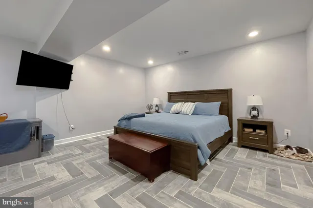 a view of a hallway view with wooden floor and staircase