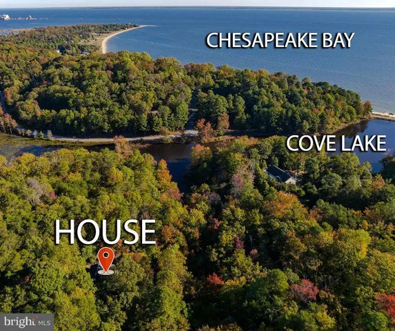 a view of a porch with a table and chairs and potted plants