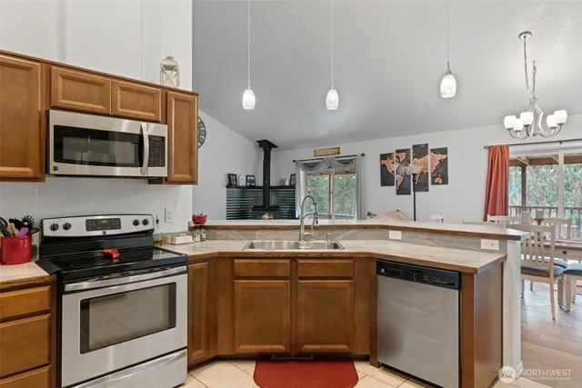 a kitchen with a stove and a microwave