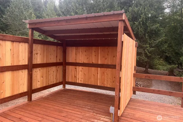a view of outdoor space with wooden floor and deck