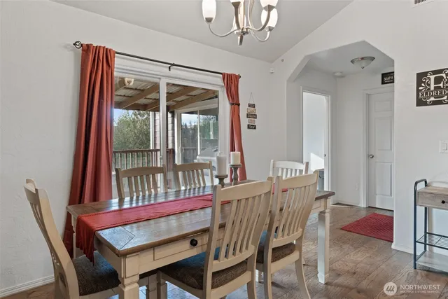 a view of a dining room with furniture window and outside view