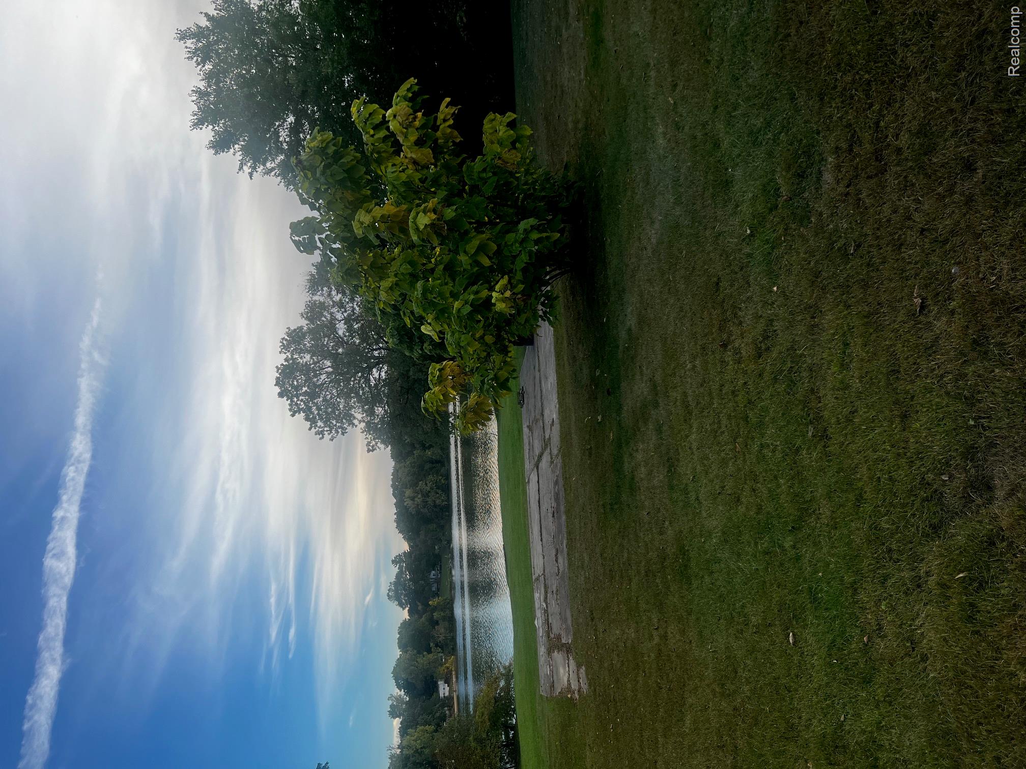3364 East Pierson Road Flint, MI 48506 - Photo 60 of 67 View of green lawn featuring a water view