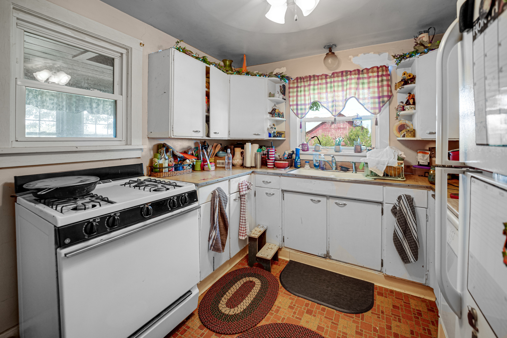 1061 Robbins Road Amboy, IL 61310 - Photo 8 of 24 a kitchen with a stove a sink and a refrigerator