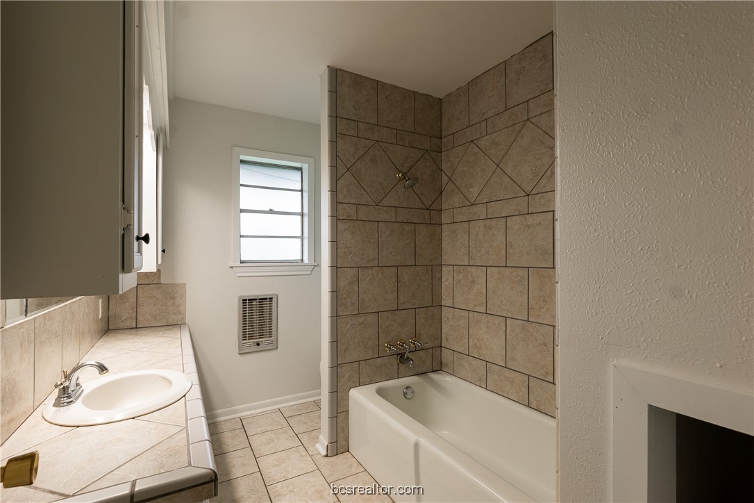 9812 Runaway Road College Station, TX 77845 - Photo 12 of 18 a bathroom with a sink a toilet and shower