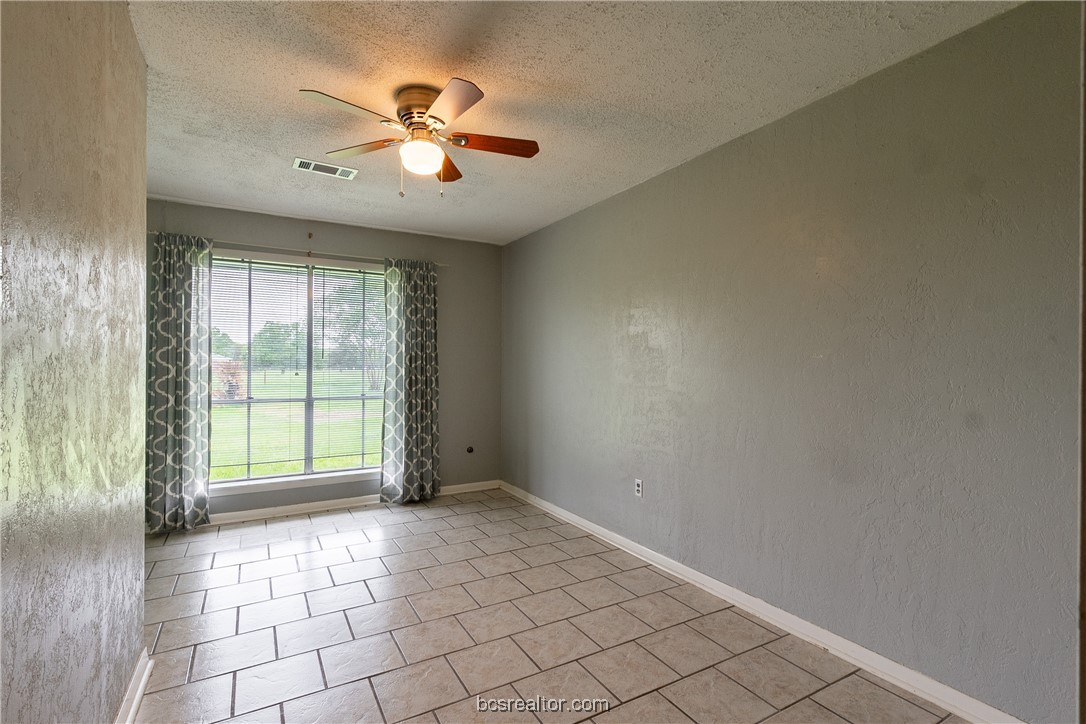 9812 Runaway Road College Station, TX 77845 - Photo 16 of 18 a view of an empty room with a window