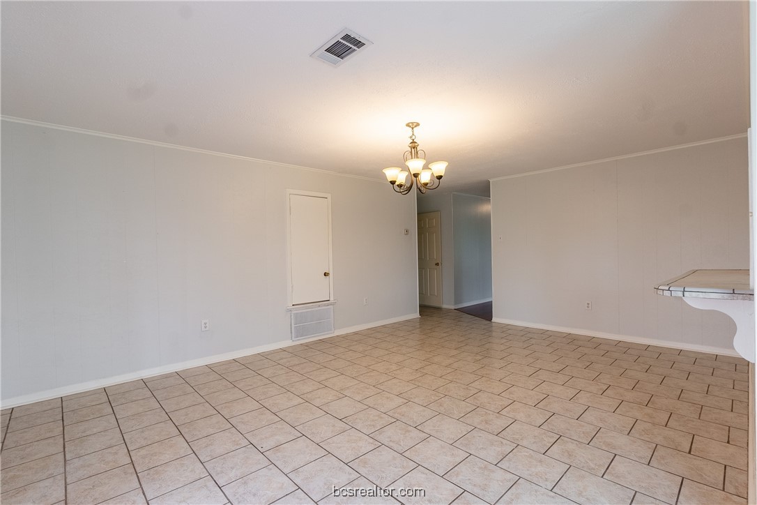 9812 Runaway Road College Station, TX 77845 - Photo 6 of 18 an empty room with chandelier fan