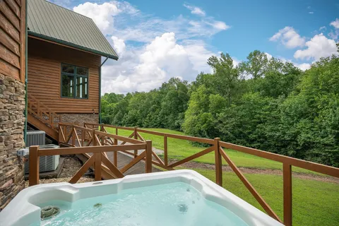 a living room with furniture a fireplace and wooden floor