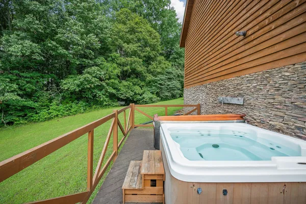 a kitchen with a stove and a wooden floor