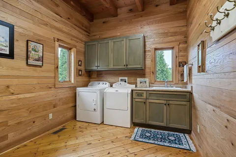 a bathroom with a granite countertop toilet sink and mirror