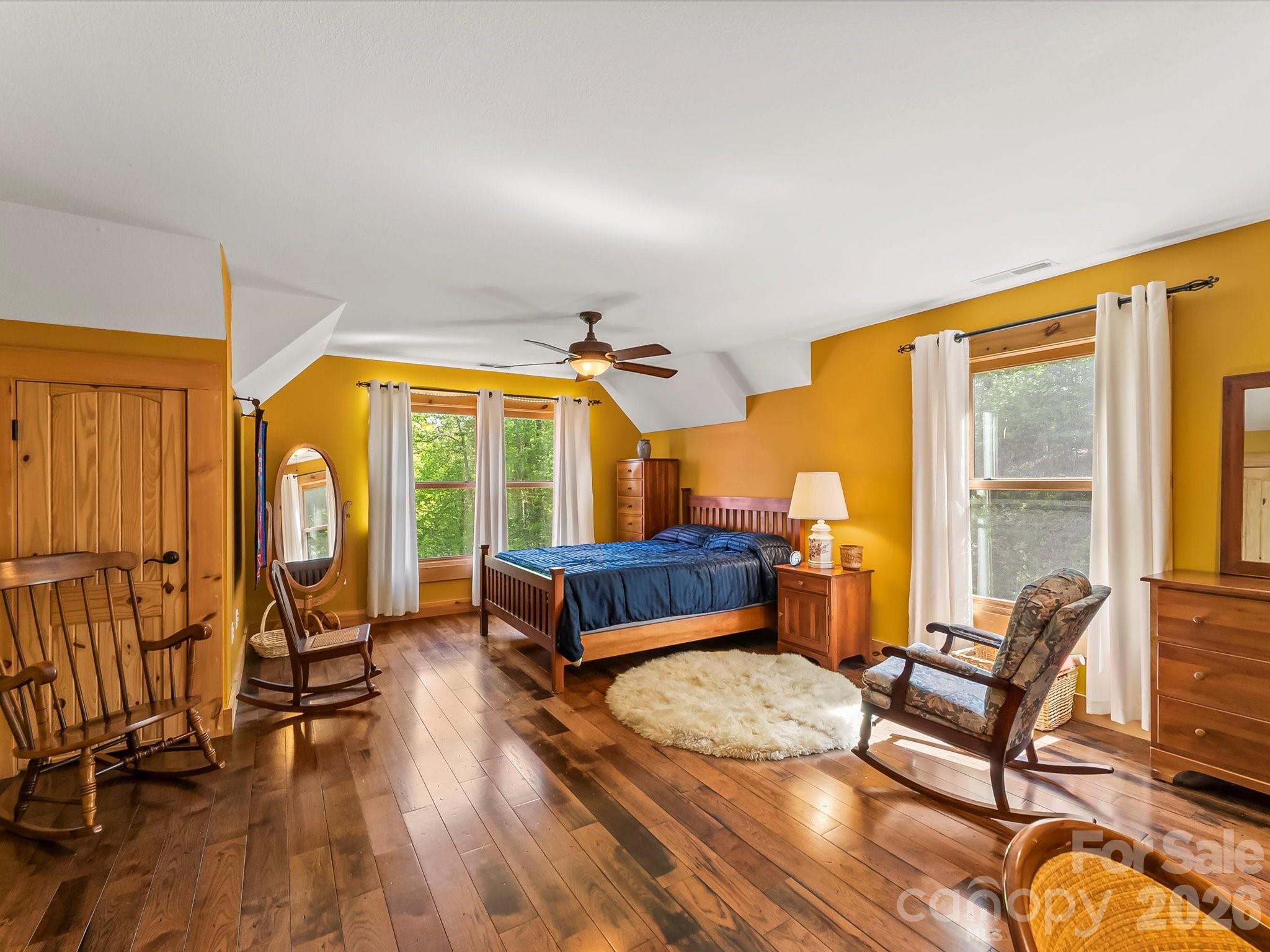 917 Otter Mountain Road Topton, NC 28781 - Photo 34 of 48 a bedroom with furniture and a large window