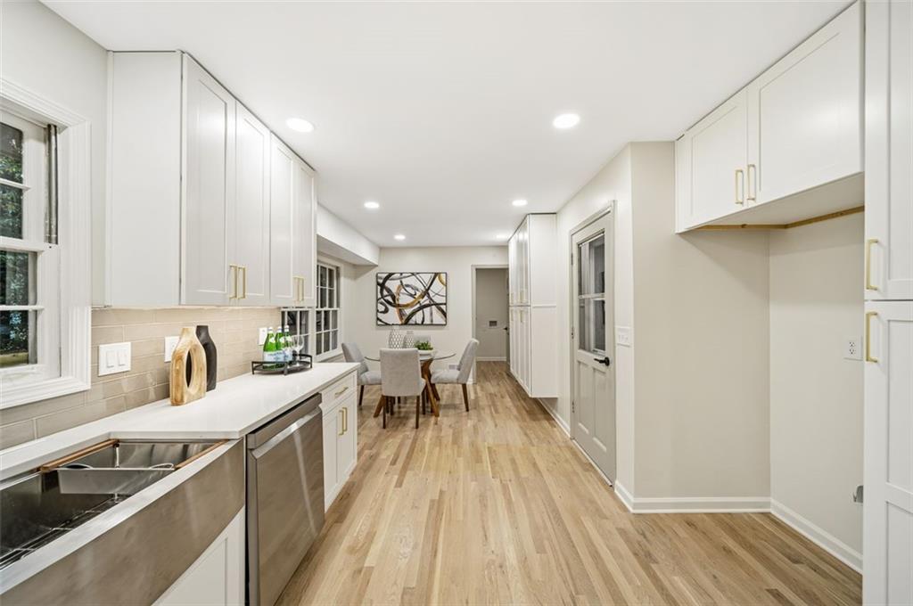 2089 Carthage Road Tucker, GA 30084 - Photo 12 of 38 a kitchen with a sink and wooden cabinets
