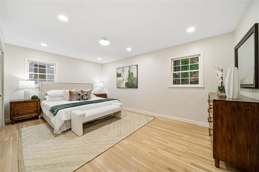 2089 Carthage Road Tucker, GA 30084 - Photo 16 of 38 a spacious bedroom with a bed and wooden floor