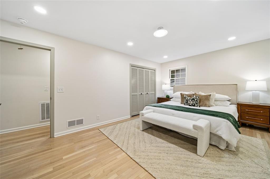 2089 Carthage Road Tucker, GA 30084 - Photo 18 of 38 a spacious bedroom with a bed and a table