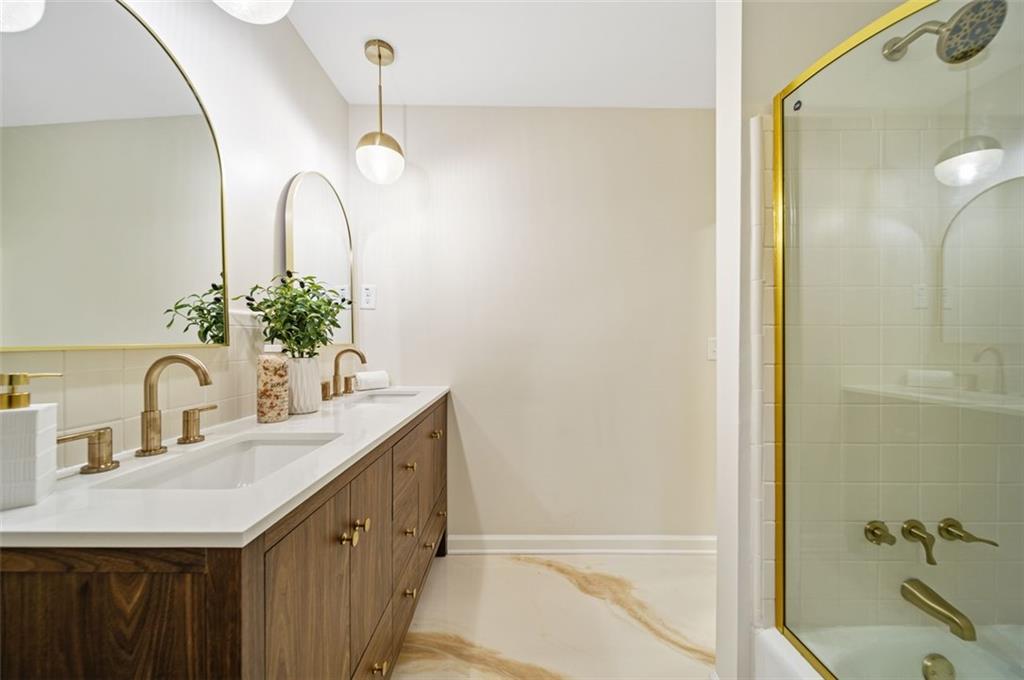 2089 Carthage Road Tucker, GA 30084 - Photo 20 of 38 a bathroom with a double vanity sink and a mirror