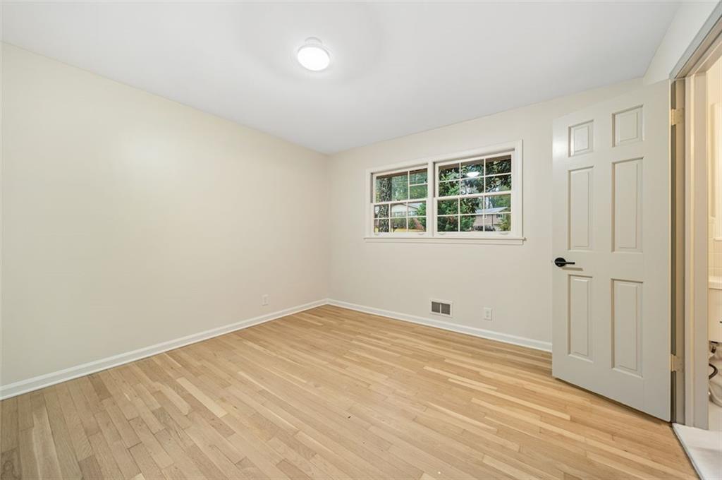 2089 Carthage Road Tucker, GA 30084 - Photo 24 of 38 a view of an empty room with wooden floor and a window