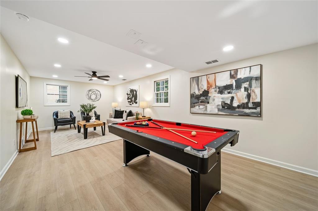 2089 Carthage Road Tucker, GA 30084 - Photo 4 of 38 a living room with furniture a pool table and a flat screen tv