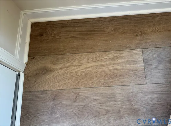 a kitchen with stainless steel appliances granite countertop a stove top oven a sink and a white cabinets