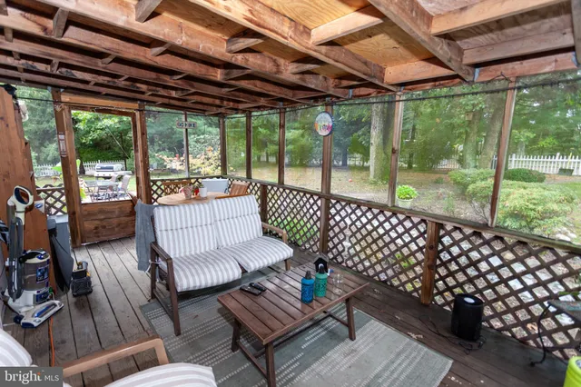a view of a patio with wooden floor