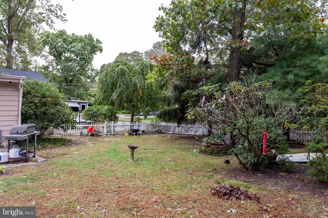 a view of a backyard with swimming pool