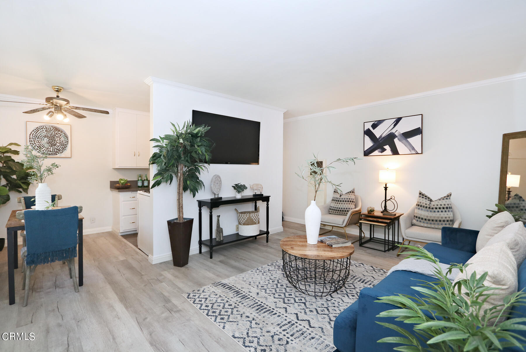 1023 East Appleton Street, Unit 5 Long Beach, CA 90802 - Photo 1 of 15 a living room with furniture a rug and a flat screen tv