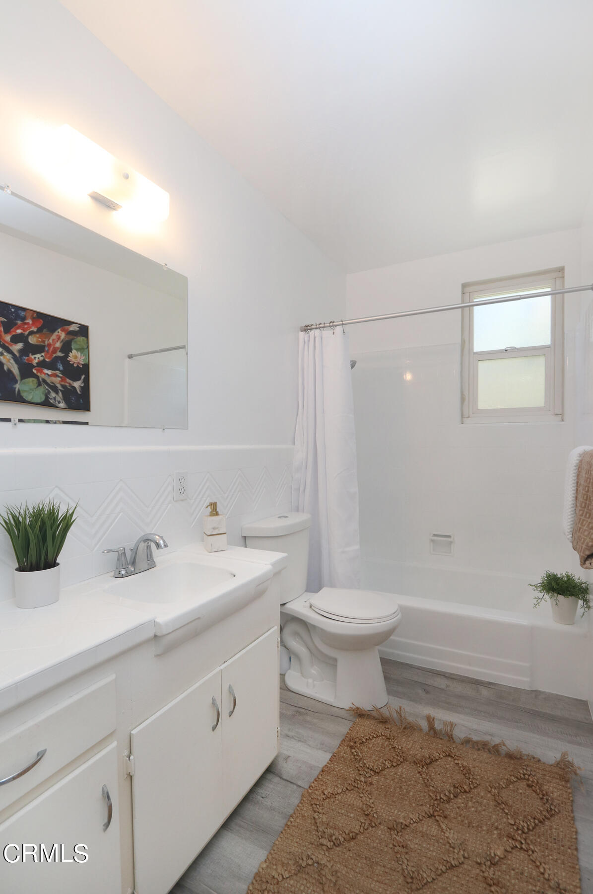 1023 East Appleton Street, Unit 5 Long Beach, CA 90802 - Photo 11 of 15 a bathroom with a sink a toilet and shower