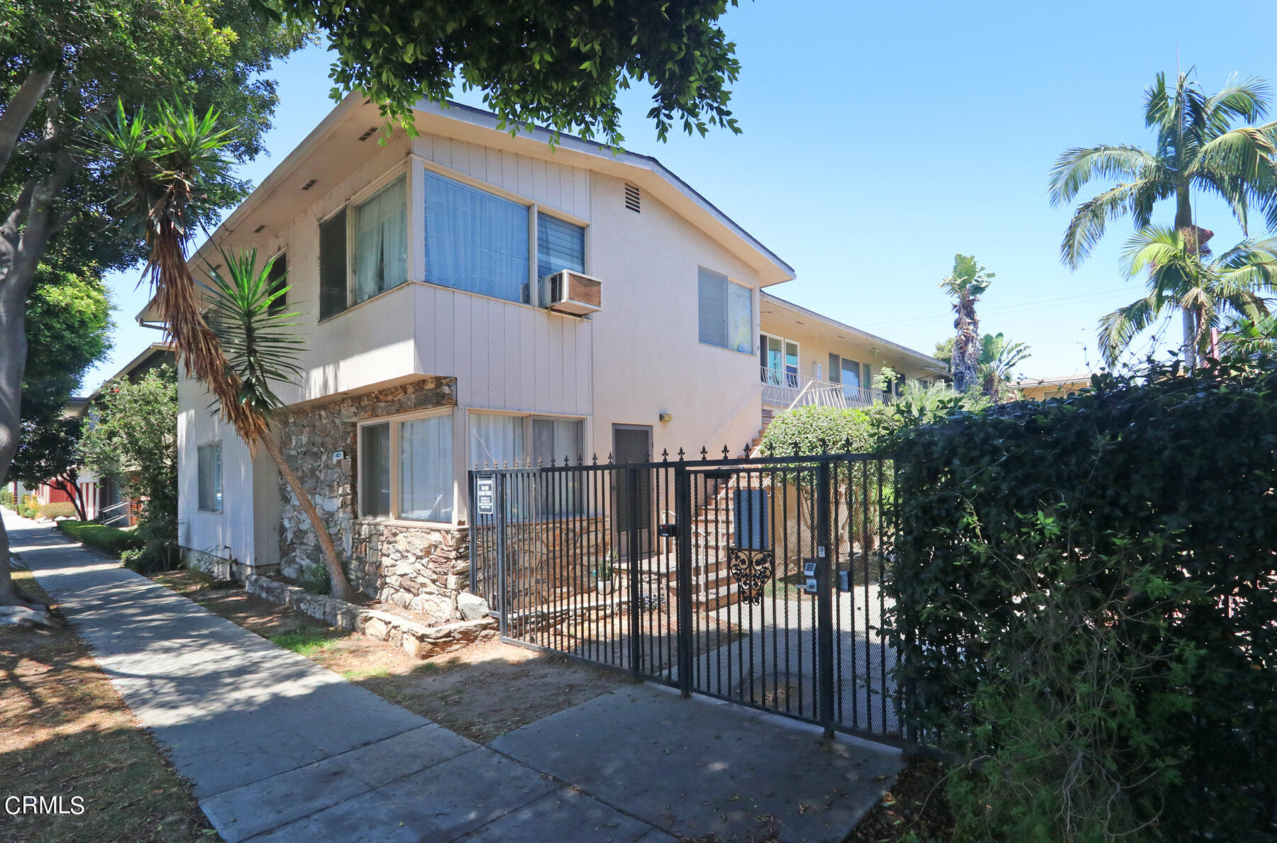 1023 East Appleton Street, Unit 5 Long Beach, CA 90802 - Photo 15 of 15 a front view of a house with a yard