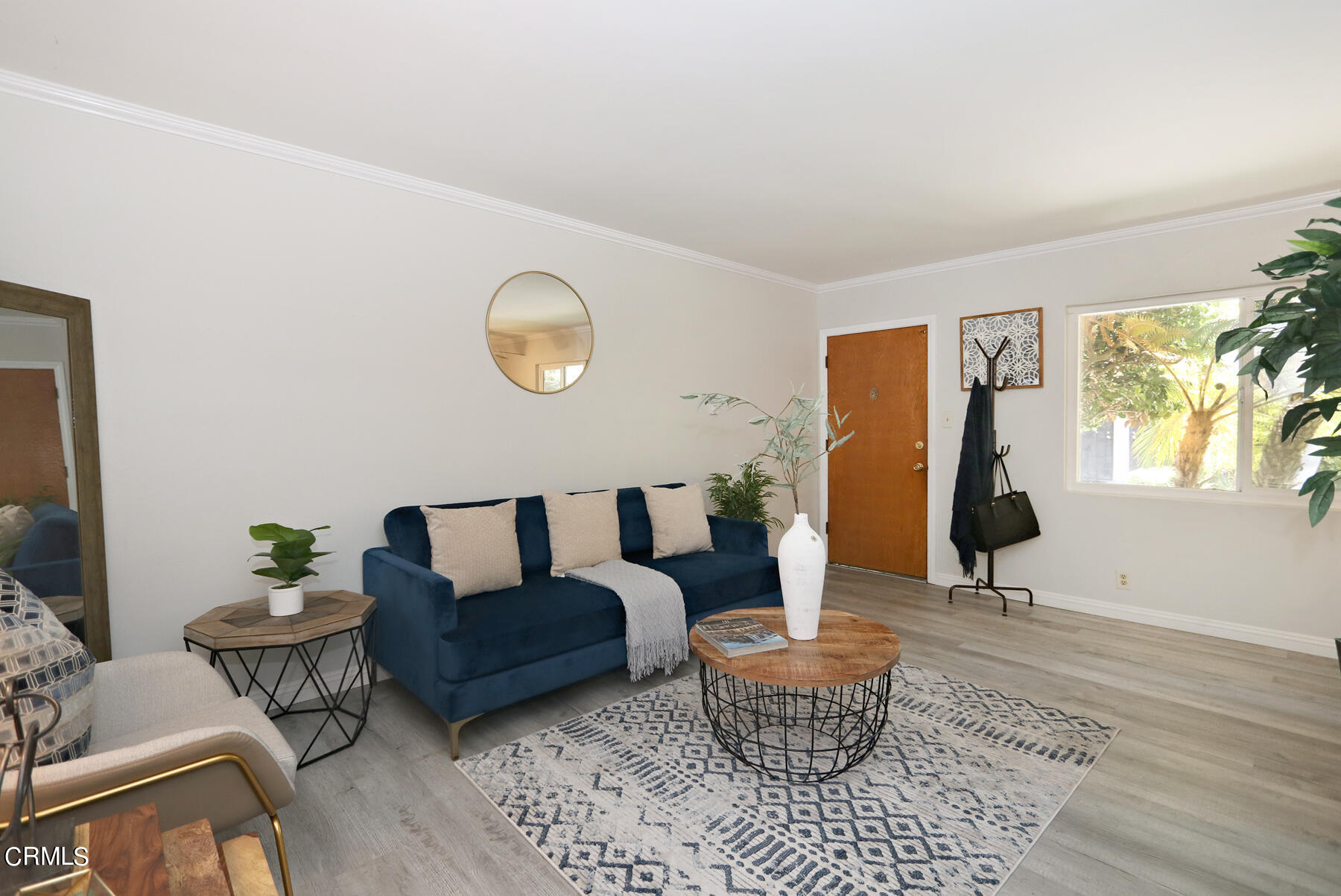 1023 East Appleton Street, Unit 5 Long Beach, CA 90802 - Photo 4 of 15 a living room with furniture a rug and a window