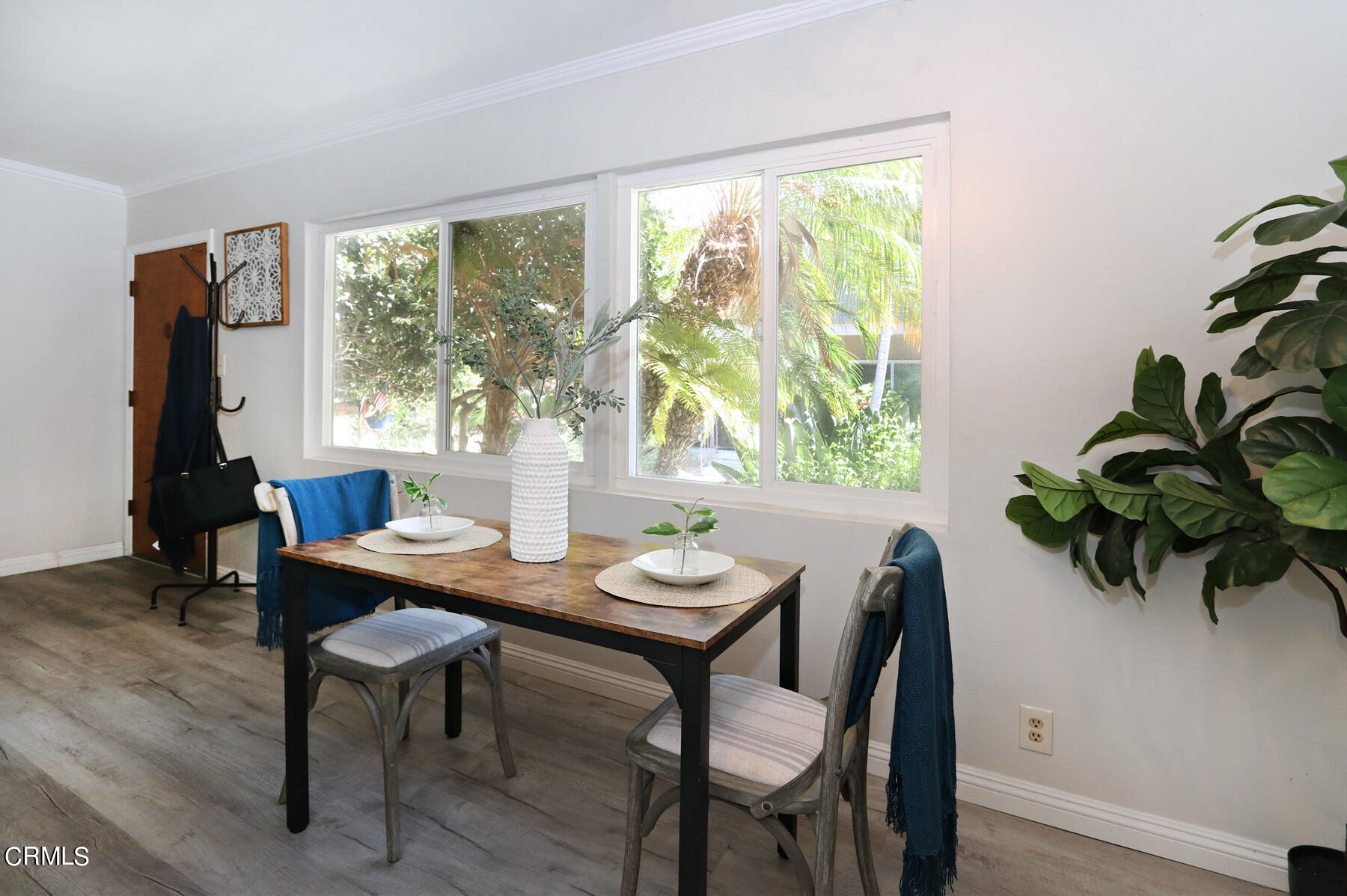 1023 East Appleton Street, Unit 5 Long Beach, CA 90802 - Photo 7 of 15 a view of a dining room with furniture window and outside view