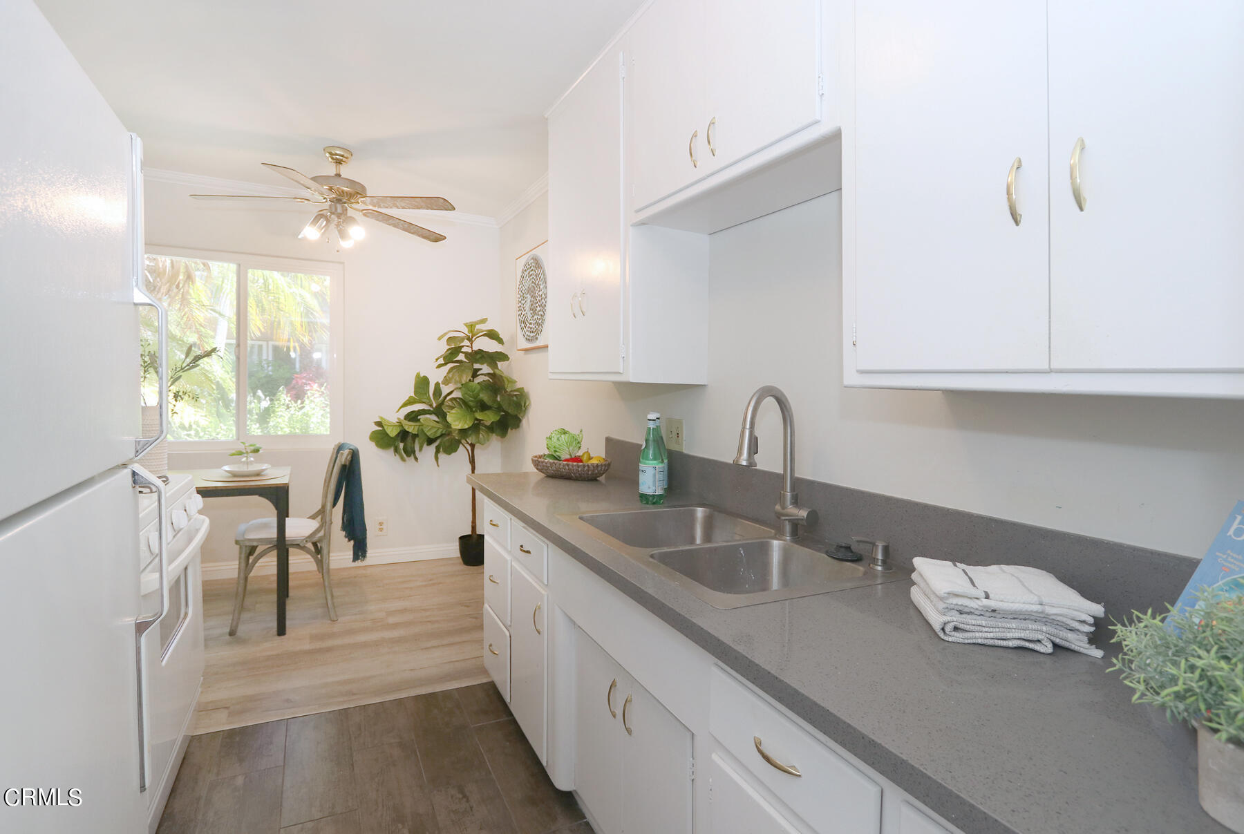 1023 East Appleton Street, Unit 5 Long Beach, CA 90802 - Photo 8 of 15 a kitchen with stainless steel appliances granite countertop a sink a stove and cabinets