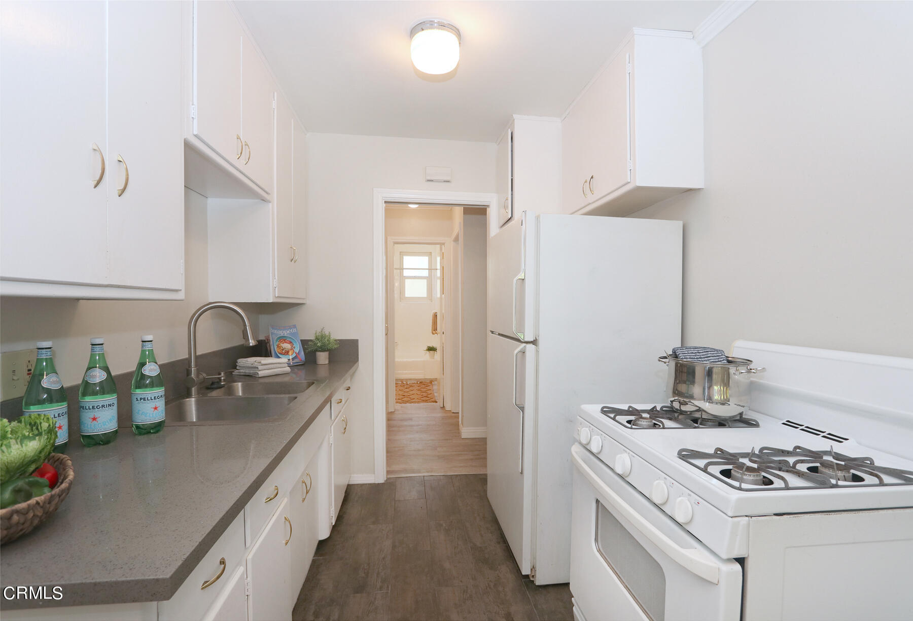 1023 East Appleton Street, Unit 5 Long Beach, CA 90802 - Photo 9 of 15 a kitchen that has a sink and a stove