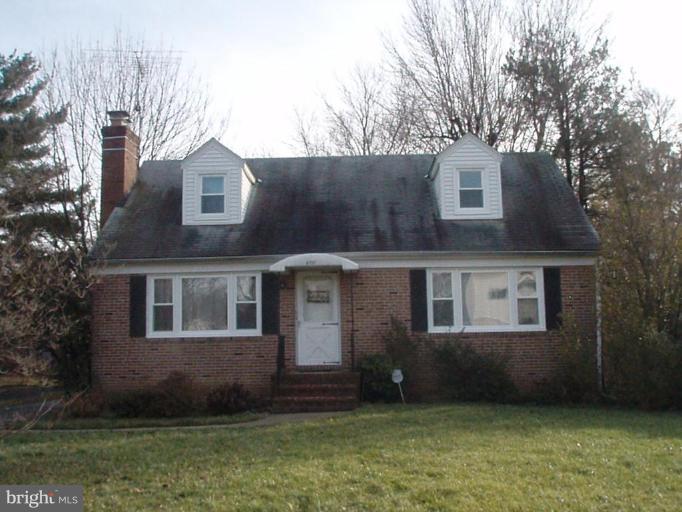 4131 Raleigh Road Pikesville, MD 21208 - Photo 1 of 11 a front view of a house with a garden