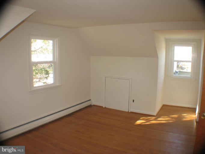 4131 Raleigh Road Pikesville, MD 21208 - Photo 10 of 11 an empty room with a window