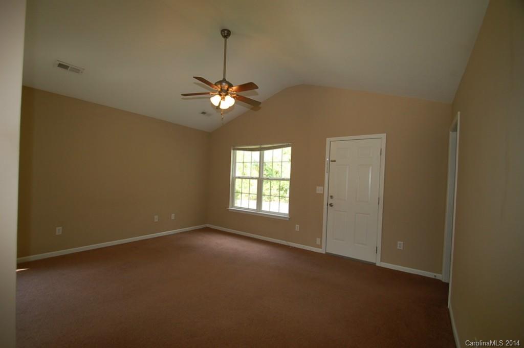 918 Valley Ridge Road Charlotte, NC 28214 - Photo 2 of 12 a view of a livingroom with a ceiling fan and window
