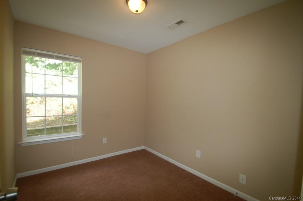918 Valley Ridge Road Charlotte, NC 28214 - Photo 11 of 12 an empty room with a window