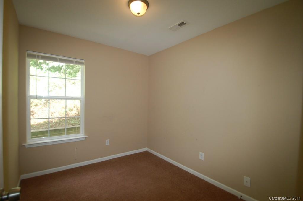 918 Valley Ridge Road Charlotte, NC 28214 - Photo 12 of 12 an empty room with a window