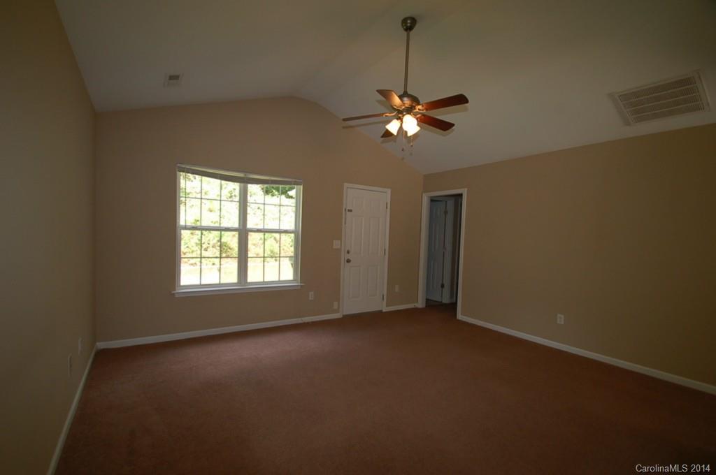 918 Valley Ridge Road Charlotte, NC 28214 - Photo 3 of 12 a view of an empty room with a window