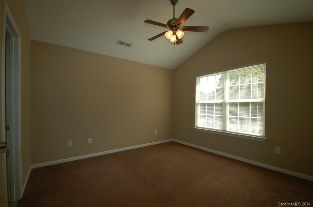 918 Valley Ridge Road Charlotte, NC 28214 - Photo 6 of 12 an empty room with a window
