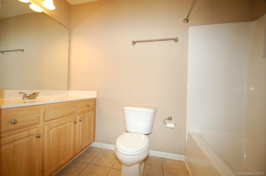 918 Valley Ridge Road Charlotte, NC 28214 - Photo 7 of 12 a bathroom with a toilet sink and mirror