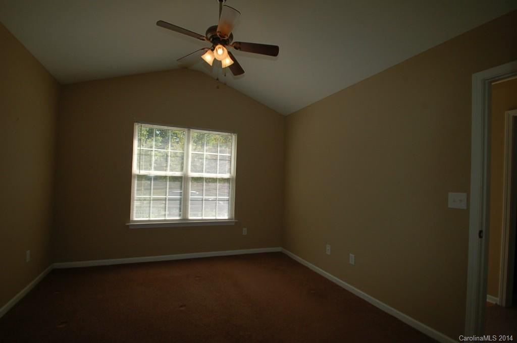 918 Valley Ridge Road Charlotte, NC 28214 - Photo 8 of 12 an empty room with a window