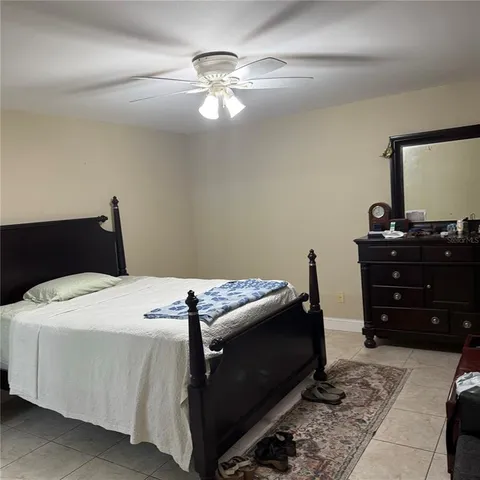 a bedroom with a bed and a dresser