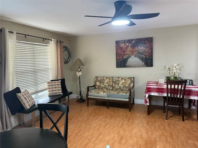 a living room with furniture and a window