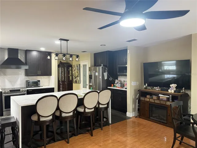 a very nice looking dining room with a table chairs and entryway