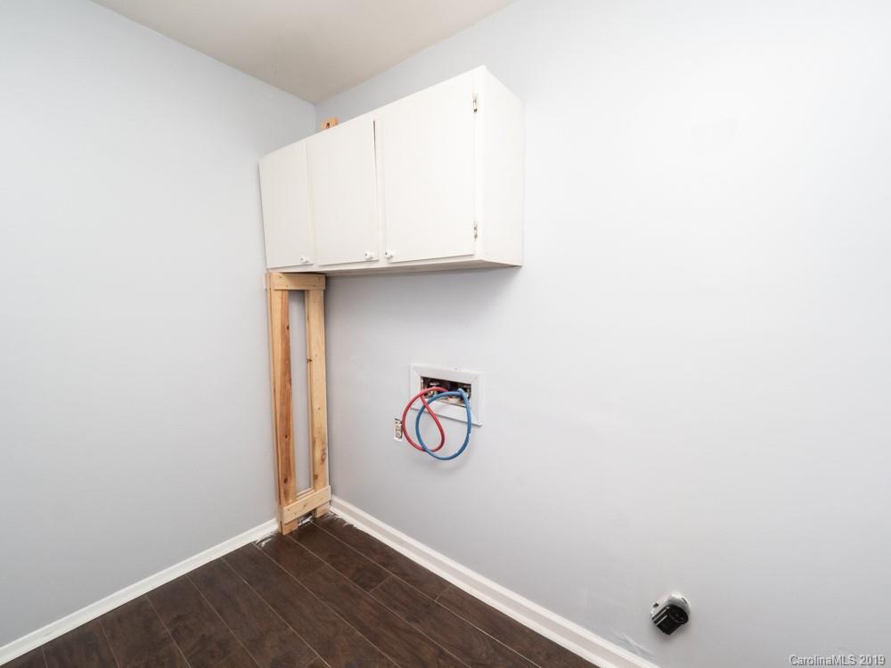 1300 Rock Point Road Charlotte, NC 28270 - Photo 2 of 13 a view of storage and utility room with wooden floor