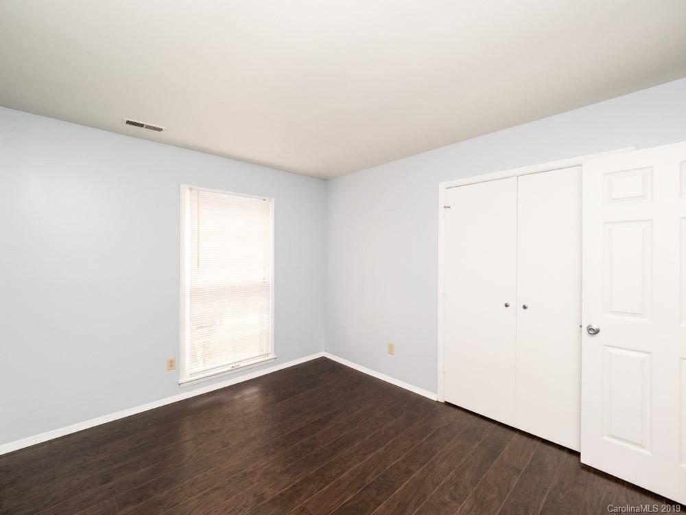 1300 Rock Point Road Charlotte, NC 28270 - Photo 12 of 13 an empty room with wooden floor and window