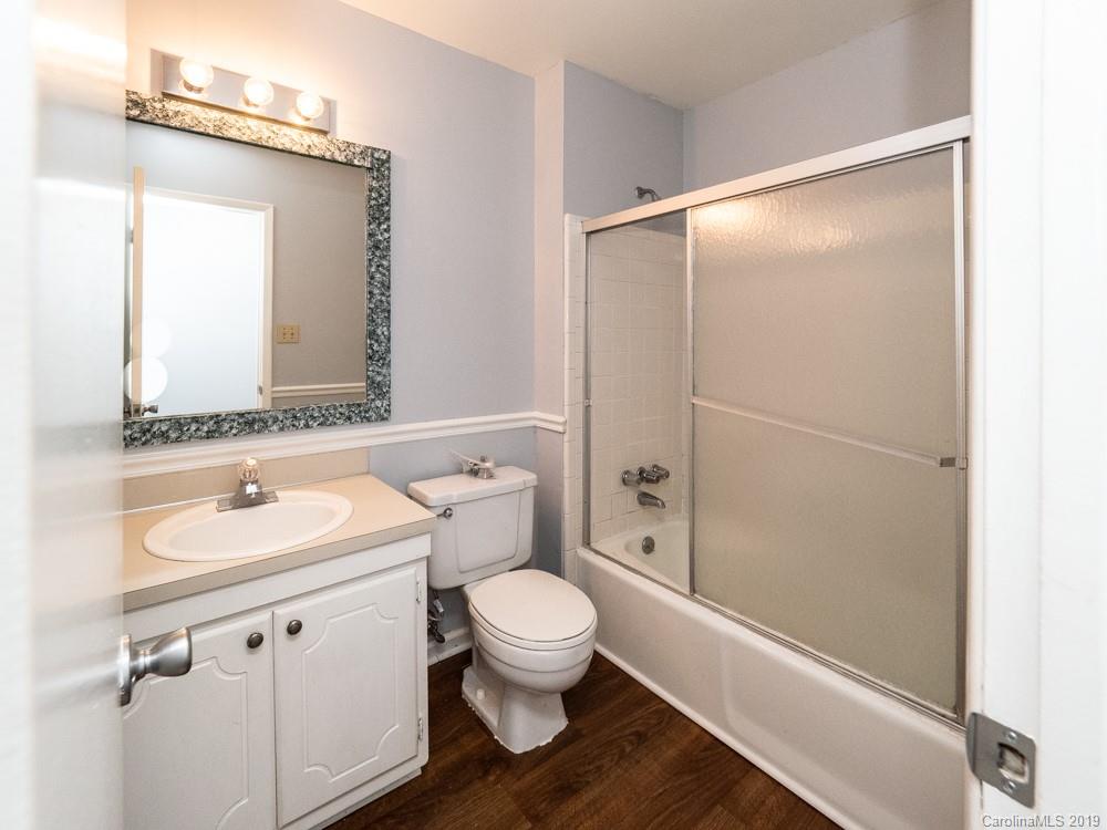 1300 Rock Point Road Charlotte, NC 28270 - Photo 7 of 13 a bathroom with a sink a toilet a mirror and shower