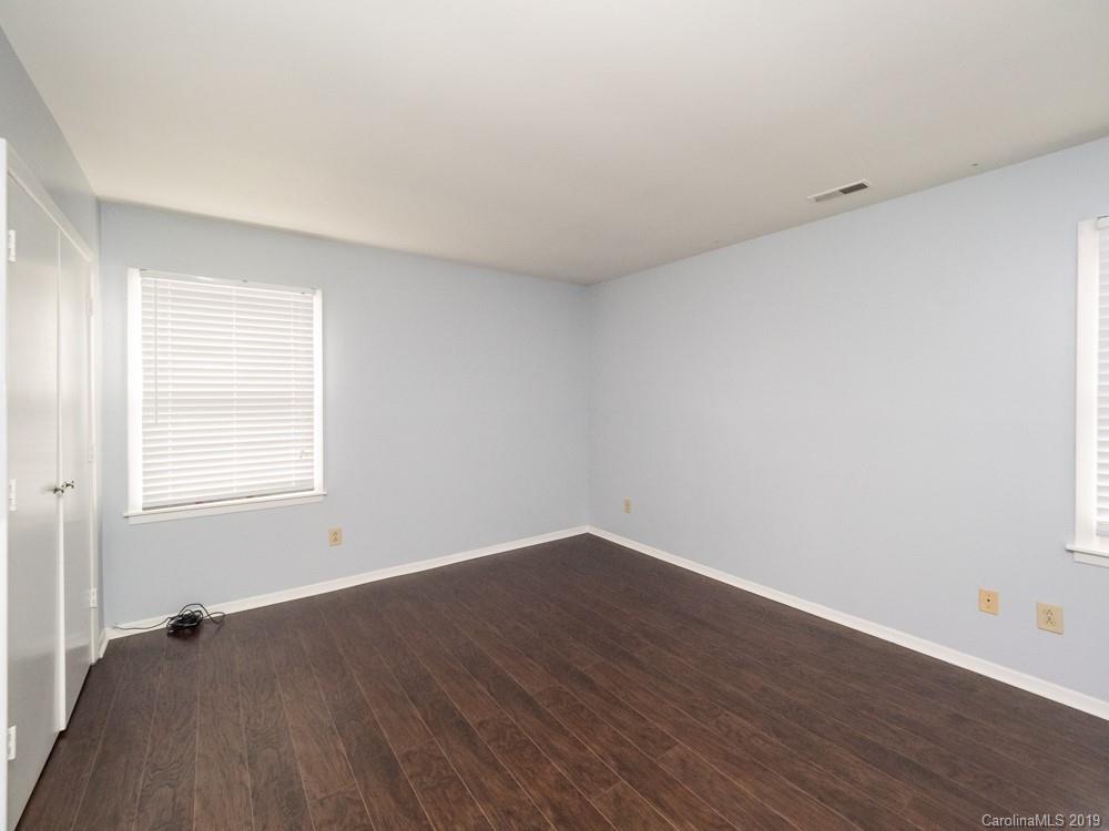 1300 Rock Point Road Charlotte, NC 28270 - Photo 8 of 13 an empty room with wooden floor and windows