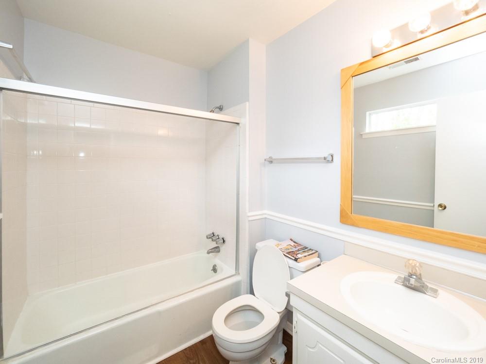 1300 Rock Point Road Charlotte, NC 28270 - Photo 9 of 13 a bathroom with a sink a toilet and a bathtub