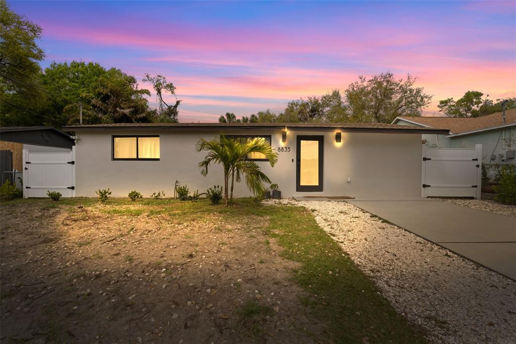 a house with trees in the background